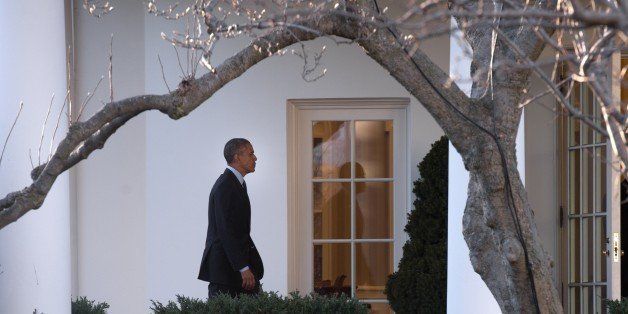 US President Barack Obama walks to the Oval Office upon his return to the White House in Washington on January 22, 2015 from a two-day trip to Idaho and Kansas. AFP HOTO/NICHOLAS KAMM (Photo credit should read NICHOLAS KAMM/AFP/Getty Images)