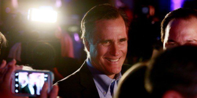 SAN DIEGO, CA - JANUARY 16: Mitt Romney is greeted by fellow Republicans at a dinner during the Republican National Committee's Annual Winter Meeting aboard the USS Midway on January 16, 2015 in San Diego, California. Romney is contemplating a possible 2016 presidential run. (Photo by Sandy Huffaker/Getty Images)