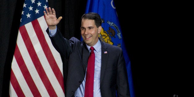 WEST ALLIS, WI - NOVEMBER 4: Wisconsin Gov. Scott Walker greets supporters at his election night party November 4, 2014 in We