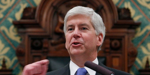 FILE - In this Jan. 20, 2015 file photo, Michigan Gov. Rick Snyder delivers his State of the State address to a joint session of the House and Senateat the state Capitol in Lansing, Mich. Snyder used his State of the State address to keep alive legislation that would update Michigan's civil rights law to provide protections for gays. But the new Legislature with expanded Republican majorities is not interested, leaving advocates to eye a 2016 ballot initiative. (AP Photo/Al Goldis)