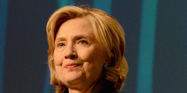 BOSTON, MA - DECEMBER 04: Former United States Secretary of State, Hillary Rodham Clinton speaks on stage at the 2014 Massachusetts Conference for Women at Boston Convention & Exhibition Center on December 4, 2014 in Boston, Massachusetts. (Photo by Lisa Lake/Getty Images for Massachusetts Conference for Women)