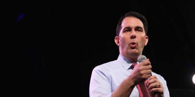 DES MOINES, IA - JANUARY 24: Wisconsin Gov. Scott Walker speaks to guests at the Iowa Freedom Summit on January 24, 2015 in Des Moines, Iowa. The summit is hosting a group of potential 2016 Republican presidential candidates to discuss core conservative principles ahead of the January 2016 Iowa Caucuses. (Photo by Scott Olson/Getty Images)