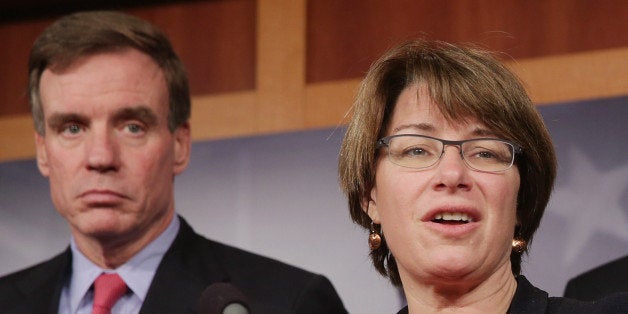 WASHINGTON, DC - OCTOBER 31: (L-R) Sen. Mark Warner (D-VA), Sen. Amy Klobuchar (D-MN), Sen. Robert Casey (D-PA) and Sen. Ben