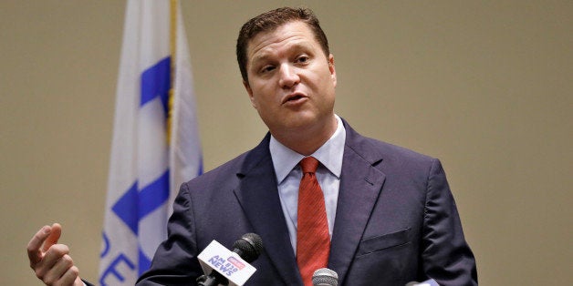 Florida Sen. Jeff Brandes, R-St. Petersburg, gestures during a news conference Tuesday, Dec. 17, 2013, in Clearwater, Fla., about a new legislative proposal regarding flood insurance. The proposal will provide private sector flood insurance alternatives to the rising rates of the National Flood Insurance Program for Florida policyholders. (AP Photo/Chris O'Meara)