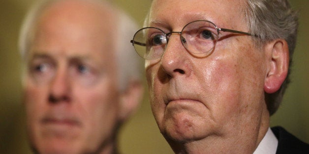 WASHINGTON, DC - DECEMBER 09: U.S. Senate Minority Leader Sen. Mitch McConnell (R-KY) (R), and Senate Minority Whip Sen. John Cornyn (R-TX) (L), listen as the Senate Republican speak to members of the media after the Senate Republican Policy Luncheon at the Capitol December 9, 2014 on Capitol Hill in Washington, DC. The Senate Republican leadership responded to a report on CIA's use of torture conducted by the Senate Intelligence Committee where were released today. (Photo by Alex Wong/Getty Images)