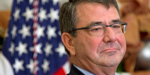 Ashton Carter listens as President Barack Obama announces he will nominate Carter for defense secretary, Friday, Dec. 5, 2014, in the Roosevelt Room of the White House in Washington. (AP Photo/Jacquelyn Martin)