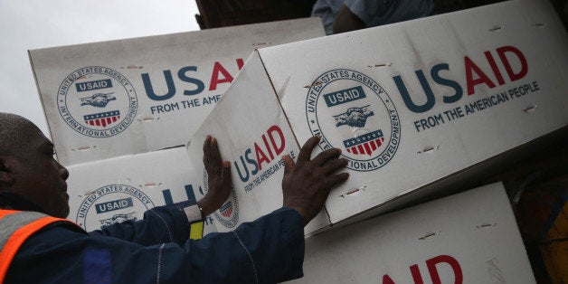 HARBEL, LIBERIA - AUGUST 24: Workers unload medical supplies to fight the Ebola epidemic from a USAID cargo flight on August 24, 2014 in Harbel, Liberia. The U.S. government sent more than 16 tons of supplies, including anti-contamination clothing (PPE), plasting sheeting and water purification machinery. International aid agencies and the Liberian government are struggling to keep up with the rapidly-expanding epidemic. The deadly virus has killed at least 1,400 people in West Africa and more in Liberia than any other country. (Photo by John Moore/Getty Images)