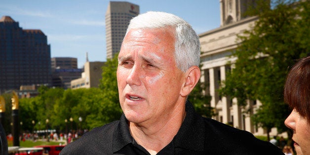 INDIANAPOLIS, IN - MAY 24: Indiana governor Mike Pence attends the 2014 IPL 500 Festival Parade during the 2014 Indy 500 Fest