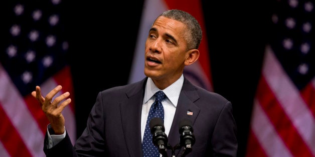 U.S. President Barack Obama speaks at the Siri Fort Auditorium, a government-run event center, in New Delhi, India, Tuesday, Jan. 27, 2015. Obama gently nudged India Tuesday to fulfill its constitution's pledge to uphold the "dignity of the individual," drawing on his own experience as a minority in the United States as he closed out a three-day visit to New Delhi. (AP Photo/Saurabh Das)