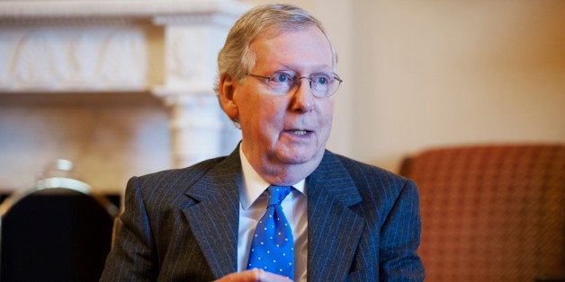 UNITED STATES - DECEMBER 10: Senate Majority Leader Mitch McConnell, R-Ky., holds a meeting in his Capitol office with Senator-elect Rep. Bill Cassidy, R-La., and his wife Laura, December 10, 2014. (Photo By Tom Williams/CQ Roll Call)