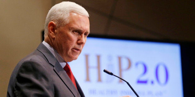 Indiana Gov. Mike Pence announces that the Centers for Medicaid and Medicare Services had approved the state's waiver request for the plan his administration calls HIP 2.0 during a speech in Indianapolis, Tuesday, Jan. 27, 2015. (AP Photo/Michael Conroy)