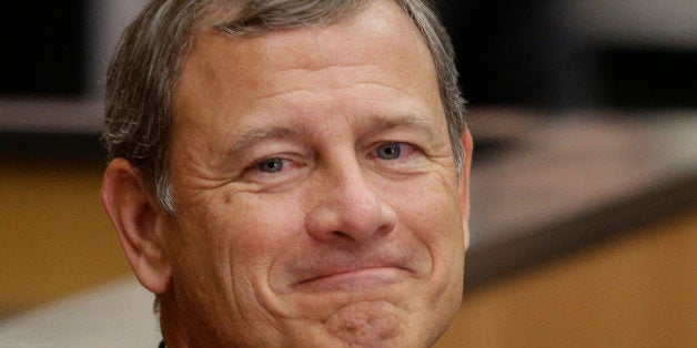 U.S. Supreme Court Chief Justice John Roberts smiles as he is introduced at the University of Nebraska Lincoln, in Lincoln, Neb., Friday, Sept. 19, 2014. Chief Justice Roberts said heâs worried about growing partisanship in the judicial confirmation process and a public perception that the court is a political body. (AP Photo/Nati Harnik)