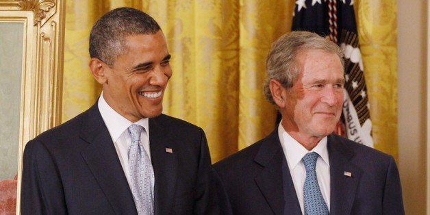 WASHINGTON, DC - MAY 31: President Barack Obama (L) and former President George W. Bush attend the unveiling ceremony for Bush's offical portrait at the White House May 31, 2012 in Washington, DC. Commissioned by the White House Historical Association, the portraits of Bush and former first lady Laura Bush will hang in the White House next to portraits of the other past presidents. (Photo by Chip Somodevilla/Getty Images)