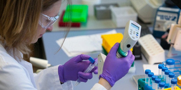 A scientist prepares test tubes ahead of testing inside the laboratory at the headquarters of Evotec AG, in Hamburg, Germany,