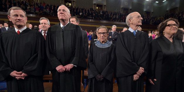 From left, Chief Justice John G. Roberts and Supreme Court justices Anthony M. Kennedy, Ruth Bader Ginsburg, Stephen G. Breyer and Sonia Sotomayor stand before President Barack Obama's State Of The Union address on Tuesday, Jan. 20, 2015, on Capitol Hill in Washington. (AP Photo/Mandel Ngan, Pool)
