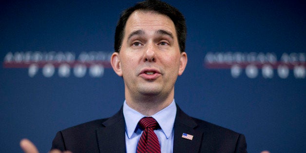 Scott Walker, governor of Wisconsin, speaks during a panel discussion at the American Action Forum in Washington, D.C., U.S., on Friday, Jan. 30, 2015. This week Walker announced the formation of a new committee to explore his presidential option dubbed 'Our American Revival,' and is the latest clue as to whether Walker would seek his party's nomination. Photographer: Andrew Harrer/Bloomberg via Getty Images 