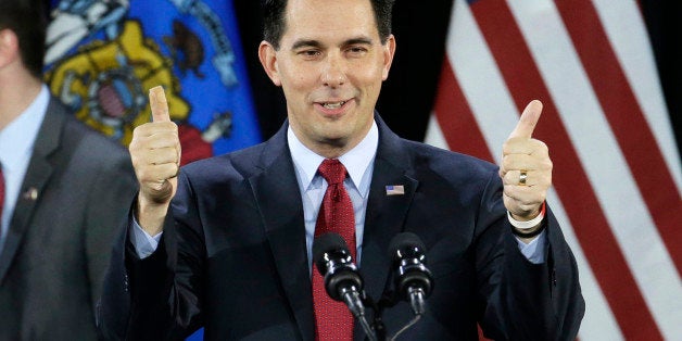 FILE - In a Tuesday, Nov. 4, 2014 file photo, Wisconsin Republican Gov. Scott Walker gives a thumbs up as he speaks at his campaign party, in West Allis, Wis. With Republicans holding even tighter control of the Wisconsin Legislature than before and Gov. Scott Walker enjoying his third statewide victory in four years, there is little to stop their agenda from moving quickly next year. (AP Photo/Morry Gash, File)