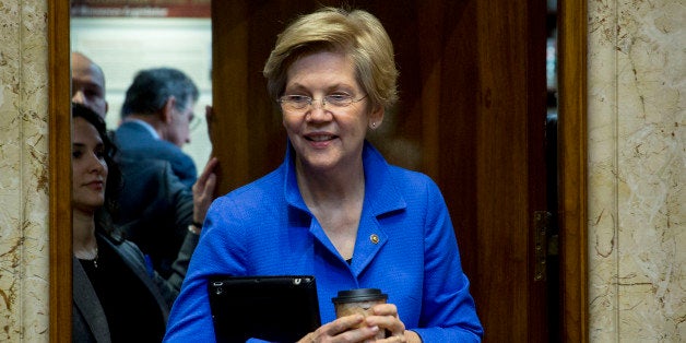 Senator Elizabeth Warren, a Democrat from Massachusetts, arrives to a Senate Energy and Natural Resources Committee business meeting to markup an original bill to approve the Keystone XL pipeline in Washington, D.C., U.S., on Thursday, Jan. 8, 2015. Senate Majority Leader Mitch McConnell has vowed to make Keystone the first bill passed in 2015. House Speaker John Boehner also plans to push a bill. Photographer: Andrew Harrer/Bloomberg via Getty Images 