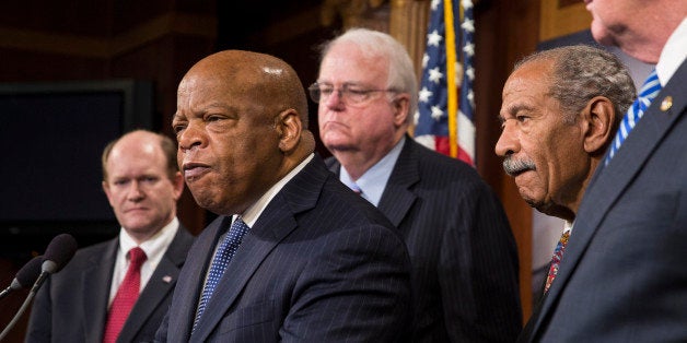 WASHINGTON, DC - JANUARY 16: (L to R) U.S. Sen. Chris Coons (D-DE), Rep. John Lewis (D-GA), Rep. Jim Sensenbrenner (R-WI), Rep. John Conyers (D-MI), and Sen. Patrick Leahy (D-VT) are seen during a news conference on Capitol Hill, January 16, 2014 in Washington, DC. The group of lawmakers announced that they are introducing legislation, the Voting Rights Amendment Act of 2014, that would restore keys parts of the 1965 Voting Rights Act. (Photo by Drew Angerer/Getty Images)