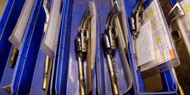 FILE - This April 2008 file photo of Model 83 revolvers ready to be test fired sitting in a bin during manufacturing at Freedom Arms gun factory in Freedom, Wyo. Wyoming lawmakers are introducing a bill to proclaim a .454-caliber revolver as the state firearm. (AP Photo/Bradly J. Boner, File)