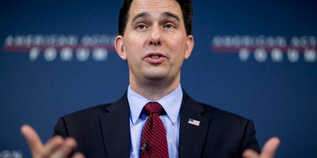 Scott Walker, governor of Wisconsin, speaks during a panel discussion at the American Action Forum in Washington, D.C., U.S., on Friday, Jan. 30, 2015. This week Walker announced the formation of a new committee to explore his presidential option dubbed 'Our American Revival,' and is the latest clue as to whether Walker would seek his party's nomination. Photographer: Andrew Harrer/Bloomberg via Getty Images 