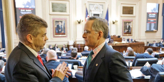 House majority leader, Del. Kirk Cox, R-Colonial heights, talks with Senate Republican floor leader, Sen. Thomas Norment, R-James City County, right during the House session at the Capitol Thursday, Feb. 21, 2013 in Richmond, Va. The General assembly is in it's last few days for the 2013 session. (AP Photo/Steve Helber)