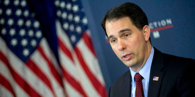 Scott Walker, governor of Wisconsin, speaks during a panel discussion at the American Action Forum in Washington, D.C., U.S., on Friday, Jan. 30, 2015. This week Walker announced the formation of a new committee to explore his presidential option dubbed 'Our American Revival,' and is the latest clue as to whether Walker would seek his party's nomination. Photographer: Andrew Harrer/Bloomberg via Getty Images
