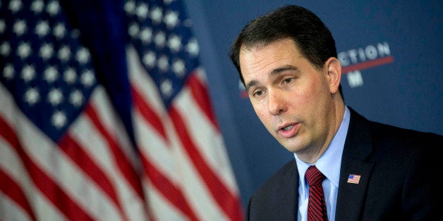 Scott Walker, governor of Wisconsin, speaks during a panel discussion at the American Action Forum in Washington, D.C., U.S., on Friday, Jan. 30, 2015. This week Walker announced the formation of a new committee to explore his presidential option dubbed 'Our American Revival,' and is the latest clue as to whether Walker would seek his party's nomination. Photographer: Andrew Harrer/Bloomberg via Getty Images 