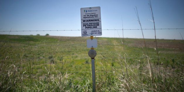 A sign marks the ground covering TransCanada's Keystone I pipeline outside of Steele City, Nebraska. The Keystone XL pipeline is set to meet the first pipeline at this location. From Oil and Water: Following the route of the Keystone XL pipeline through the USA. (Photo by Lucas Oleniuk/Toronto Star via Getty Images)