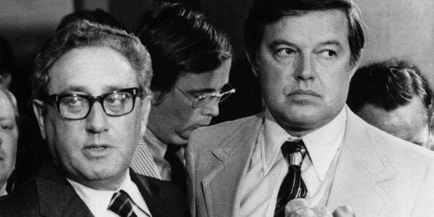 Not Involved - Secretary of State Henry Kissinger, flanked by Sen. Frank Church, D-Idaho, tells a Capitol Hill news conference Tuesday neither the Nixon for Ford administrations ever plotted to assassinate any foreign officials. Kissinger met with newsmen after appearing before Church's Senate Intelligence Committee. (AP-Photo) 12.8.1975