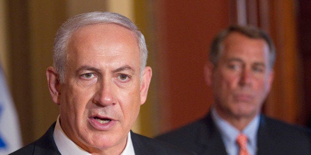 House Speaker John Boehner of Ohio looks on at right as Israeli Prime Minister Benjamin Netanyahu makes a statement on Capitol Hill in Washington, Tuesday, May 24, 2011. (AP Photo/Evan Vucci)