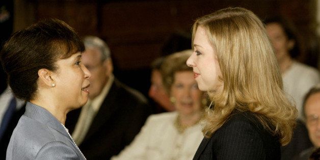 WASHINGTON - JUNE 14: Chelsea Clinton (R) talks with former Secretary of Labor Alexis Herman (L) during a ceremony to unveil Clinton portraits in the East Room of the White House June 14, 2004 in Washington, DC. Every president since George Washington has had their portrait painted and displayed either at the White House or at the Library of Congress. (Photo by Mark Wilson/Getty Images)