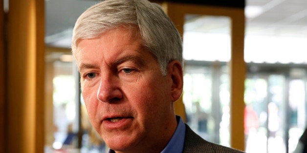 Rick Snyder, governor of Michigan, speaks to reporters at the Techonomy conference at Wayne State University in Detroit, Michigan, U.S., on Tuesday, Sept. 17, 2013. Synder, a Republican, spoke about efforts to boost technology jobs in Detroit and the city's bankruptcy. Photographer: Jeff Kowalsky/Bloomberg via Getty Images