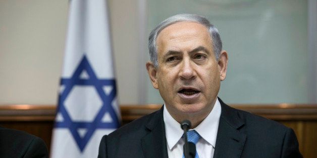 Israeli Prime Minister Benjamin Netanyahu attends the weekly cabinet meeting in his Jerusalem office, Sunday, Jan. 25, 2015. Israel's premier says he will go "anywhere" he is invited to speak about the country's stance regarding Iran's nuclear program. (AP Photo/Baz Ratner, Pool)