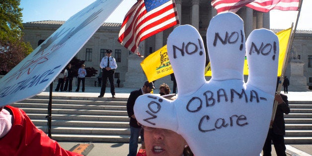 A Tea-Party supporter protest outside the US Supreme Court on the third day of oral arguements over the constitutionality of the Patient Protection and Affordable Care Act on March 28, 2012 in Washington, DC. The 26 states challenging the law argue that Affordable Care Act must be completely repealed if the requirement that all Americans buy health insurance -- known as the 'individual mandate' -- is found to be unconstitutional. AFP PHOTO/MLADEN ANTONOV (Photo credit should read MLADEN ANTONOV/AFP/Getty Images)