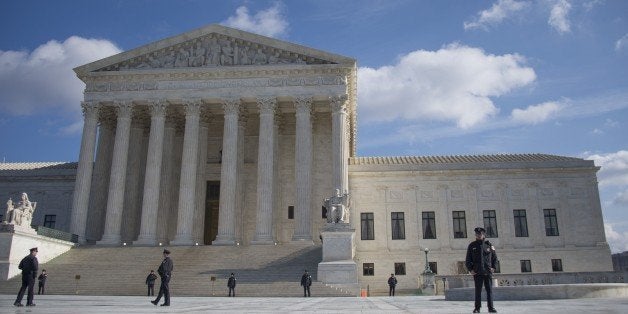 US Supreme Court police stand on the plaza ahead of pro-choice and pro-life demonstrations in front of the US Supreme Court in Washington, DC, January 22, 2015. Tens of thousands of Americans who oppose abortion are in Washington for the annual March for Life, marking the 42nd anniversary of the Supreme Court's Roe v. Wade decision. AFP PHOTO/JIM WATSON (Photo credit should read JIM WATSON/AFP/Getty Images)