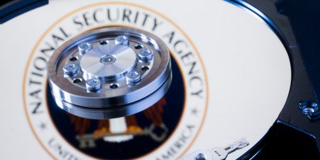 BERLIN, GERMANY - JANUARY 29: Symbolic photo for data protection, reflection of the seal of the National Security Agency in a computer hard drive on January 29, 2015 in Berlin, Germany. (Photo by Thomas Trutschel/Photothek via Getty Images)