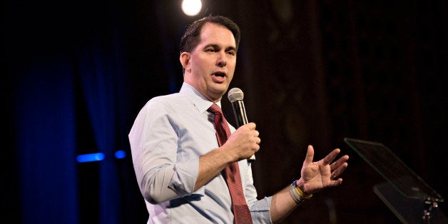 Scott Walker, governor of Wisconsin, speaks during the Iowa Freedom Summit in Des Moines, Iowa, U.S., on Saturday, Jan. 24, 2015. The talent show that is a presidential campaign began in earnest Saturday as more than 1,200 Republican activists, who probably will vote in Iowa's caucuses, packed into a historic Des Moines theater to see and hear from a parade of their party's prospective entries. Photographer: Daniel Acker/Bloomberg via Getty Images 