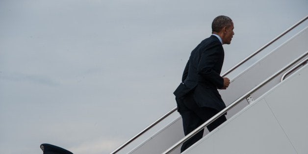 US President Barack Obama boards Air Force One at Andrews Air Force Base in Maryland as he departs for a four-day trip to Cal