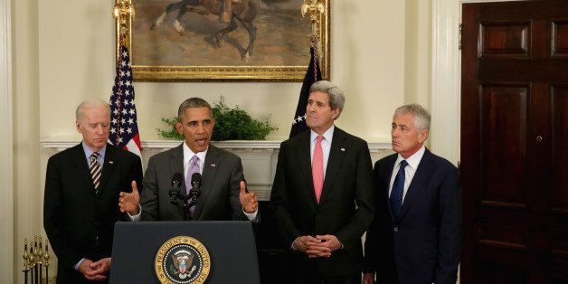 WASHINGTON, DC - FEBRUARY 11: U.S. President Barack Obama announces he has sent Congress an authorization for the use of military force against Islamic State with (L-R) Vice President Joe Biden, Secretary of State John Kerry and Defense Secretary Chuck Hagel in the Roosevelt Room at the White House February 11, 2015 in Washington, DC. Obama wants Congress to authorize a three-year military campaign against the Islamic State, also called ISIS or ISIL, that would continue the use of air power and could include limited ground operations by American forces to hunt down enemy leaders or rescue American personnel. (Photo by Chip Somodevilla/Getty Images)