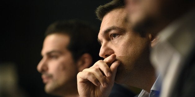 Greek Prime Minister Alexis Tsipras gives a press conference during the European Council Summit at the European Union (EU) Headquarters in Brussels on February 12, 2015. Greece's new Prime Minister Alexis Tsipras and German Chancellor Angela Merkel played down tensions today over demands by Athens to renegotiate its huge bailout as they met for the first time at a European summit. AFP PHOTO / JOHN THYS (Photo credit should read JOHN THYS/AFP/Getty Images)