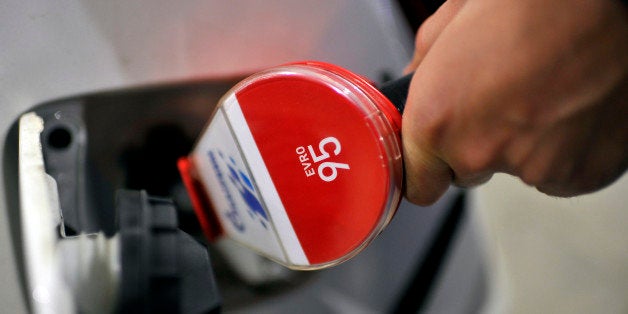 A customer refuels his automobile with 95 octane fuel at the fuel pump of an OAO Gazprom Neft gas station in Belgrade, Serbia