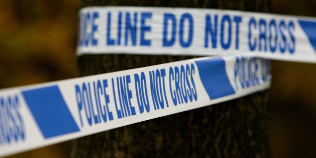 File photo dated 18/11/11 of some police tape at a crime scene, as crimes against adults in the year ending September 2014 fell by 11\% to the lowest level since 1981, the Office of National Statistics said.