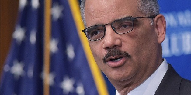 US Attorney General Eric Holder speaks on criminal justice and sentencing reform at the National Press Club on February 17, 2015 in Washington, DC. AFP PHOTO/MANDEL NGAN (Photo credit should read MANDEL NGAN/AFP/Getty Images)