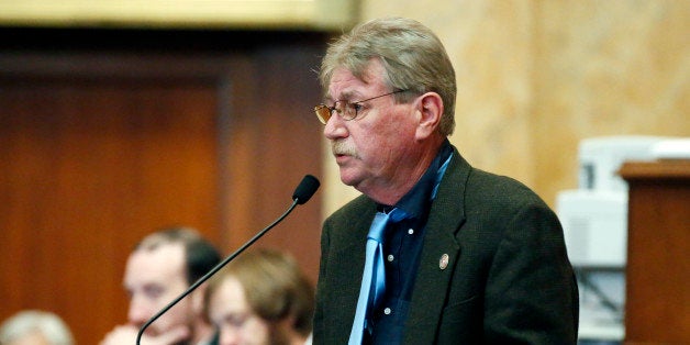 Rep. Gene Alday, a Walls Republican, stands before the entire chamber and makes his apologies for remarks he made to a newspaper about black people in his hometown, Tuesday, Feb. 17, 2015, at the Capitol in Jackson, Miss. Alday told The Clarion-Ledger newspaper in a story Sunday that in Walls, the town where he was once mayor and police chief, "all the blacks are getting food stamps and what I call `welfare crazy checks.' They don't work." (AP Photo/Rogelio V. Solis)