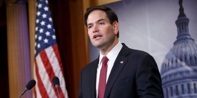 FILE - In this Dec. 17, 2014 file photo, Sen. Marco Rubio, R-Fla. speaks on Capitol Hill in Washington. Rubio seems to be moving toward a bid for the Republicans' presidential nomination, and late Sunday he joins Sens. Ted Cruz of Texas and Rand Paul of Kentucky for an audience with the conservative billionaire Koch brothers. (AP Photo/J. Scott Applewhite, File)