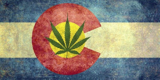 Vintage distressed retro version of the Colorado State flag with Marijuana leaf in center - controversial issue