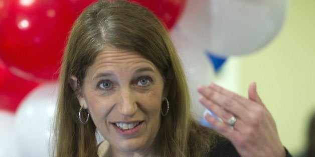 Health and Human Services Secretary Sylvia Burwell gestures while answering a reporters question following her tour of the Gr