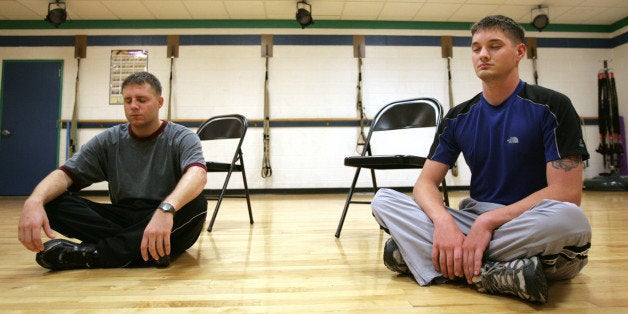 U.S. Marine Corps Corporal Pete Jarzabek, left, and Sargeant Ryan Barnett meditate during Warrior Mind Training class at Camp Lejeune in Jacksonville, N.C., Tuesday, Sept. 30, 2008. The course is catching on in military circles as a way not only to treat both post-traumatic stress and traumatic brain injuries, but also to improve focus and better prepare soldiers and Marines for the rigors of combat. (AP Photo/Logan Wallace)