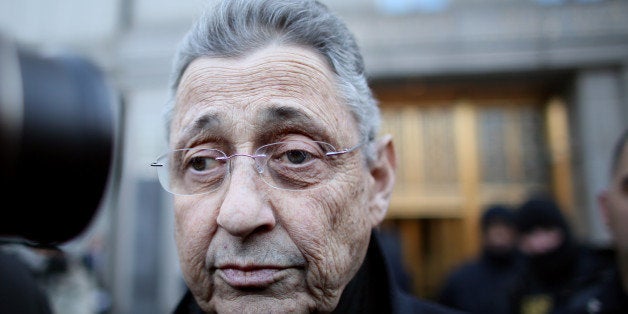 NEW YORK - JANUARY 22: New York State Assembly Speaker Sheldon Silver walks out of the Federal Courthouse after his arraignme